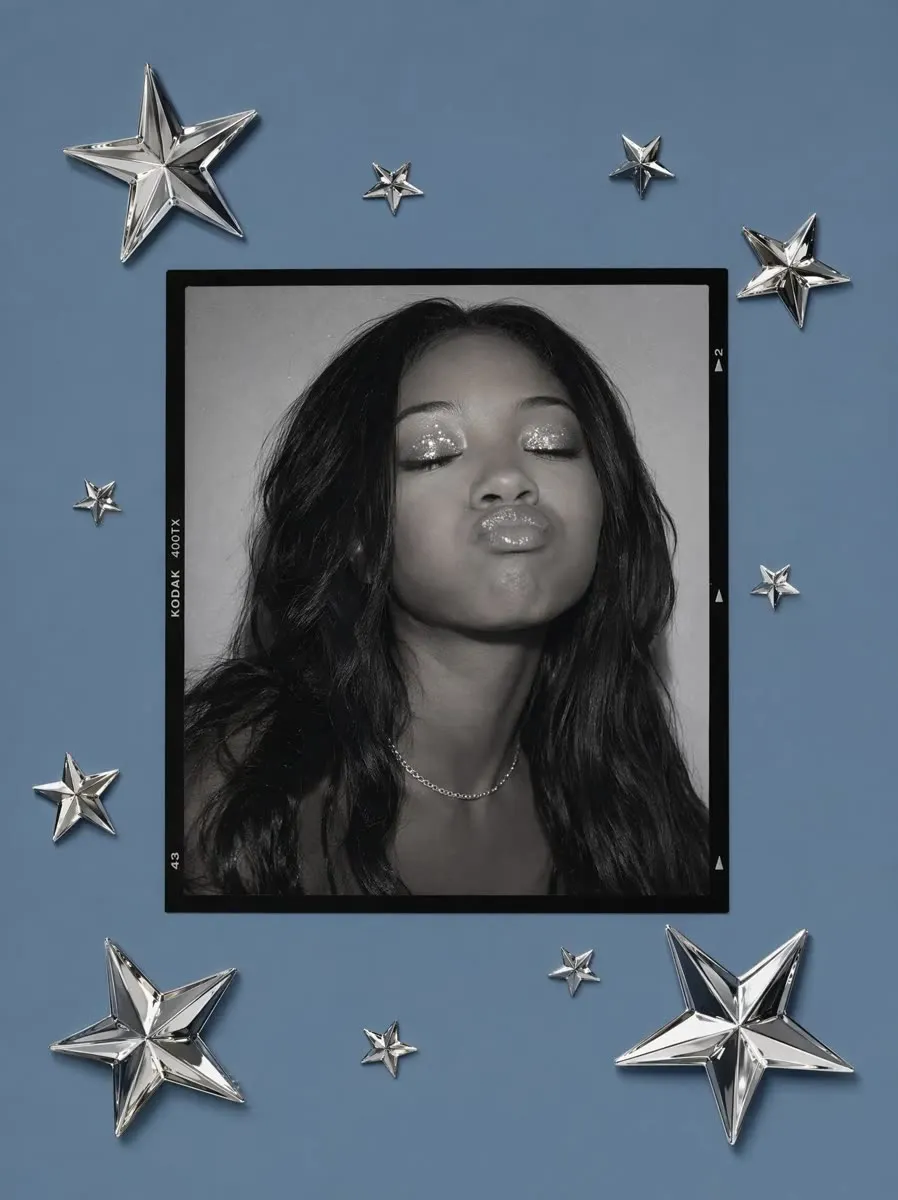 Black-and-white portrait framed with chrome stars on a blue background, made with PhotoPilot