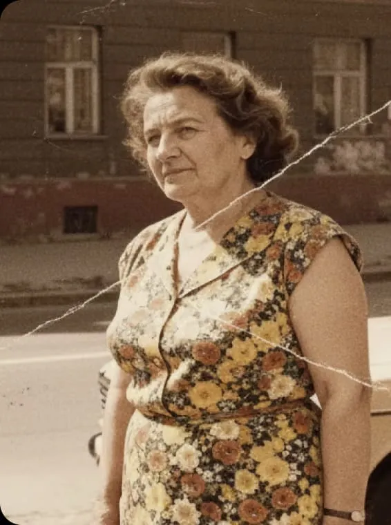 Cracked, faded portrait of a woman restored to clean colour (Before)